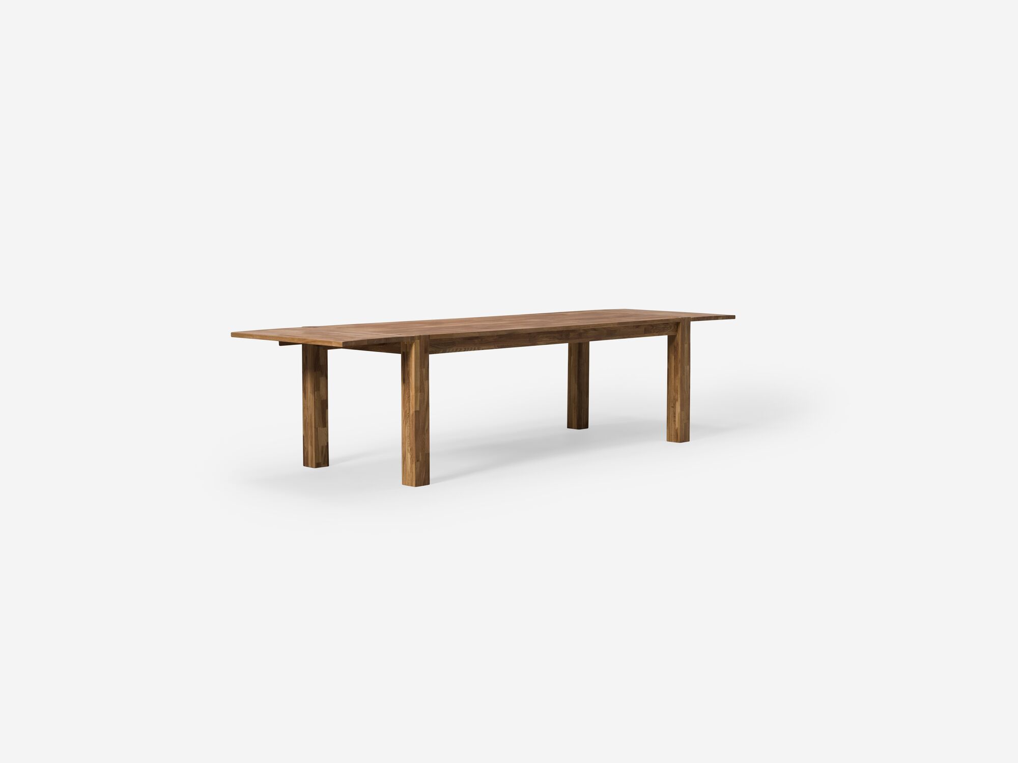 Angle view of the large oak Harvest rustic dining table with leaves